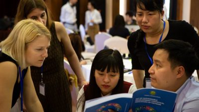 people looking at a book