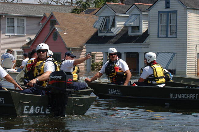 New Orleans being evacuated by FEMA personnel in boats due to flooding caused by Hurricane Katrina.