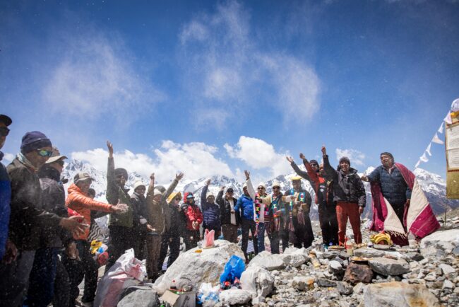Scientists and spiritual leaders celebrating on Yala Glacier