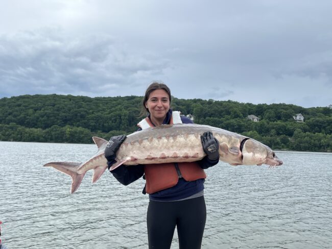 Woman holds large fish