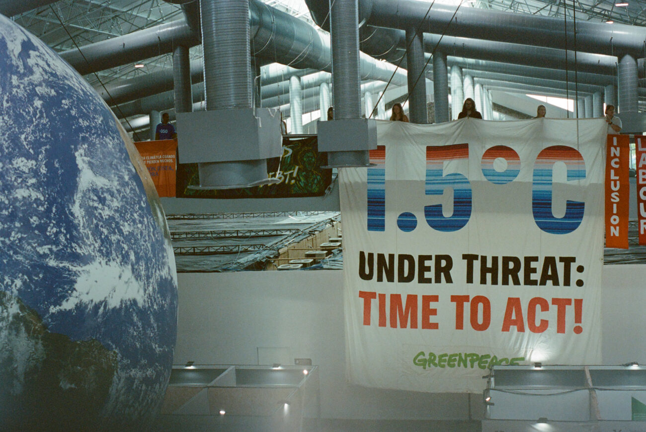 Time to Act sign at COP30