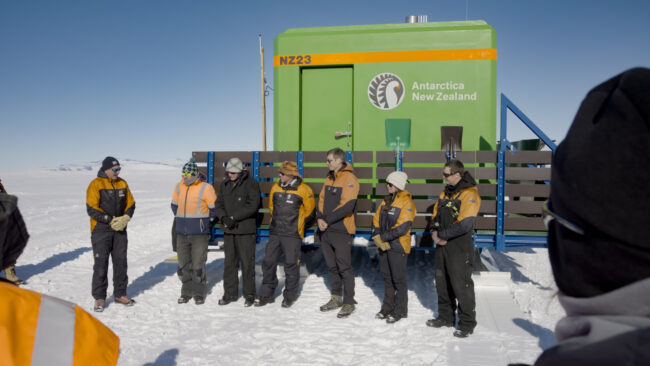 Base leader gives team speech in Antarctica