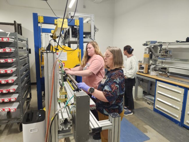 Teachers learning from scientists in the lab