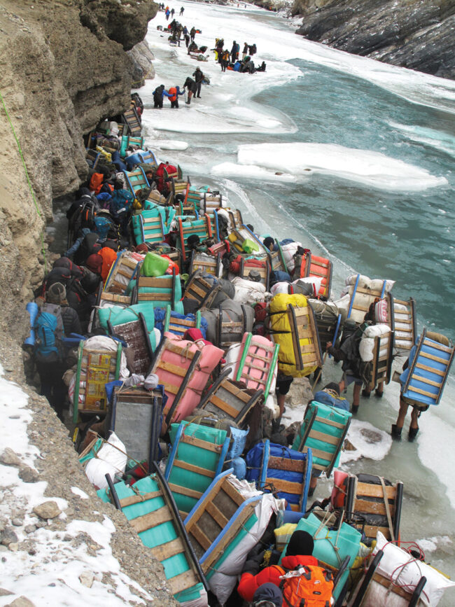 Porters wait to cross a difficult section of the Chadar