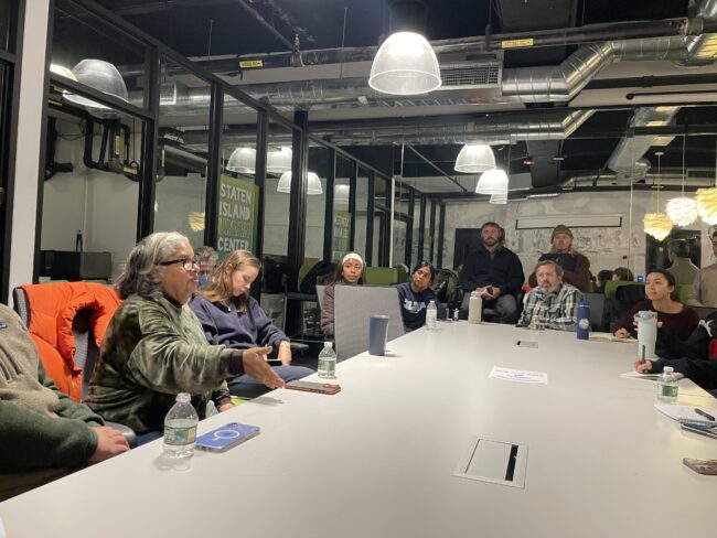 Students in the Building Climate Justice: Co-Creative Coastal Resilience Planning course around a table