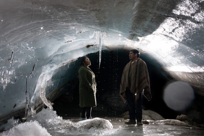 Herders stand surrounded by ice