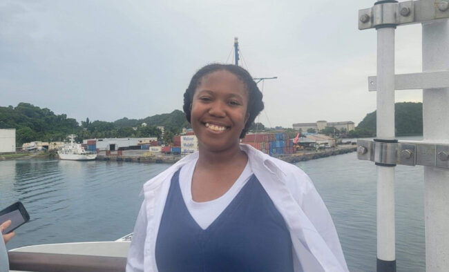 A photo of Memphis Washington on a boat near shore