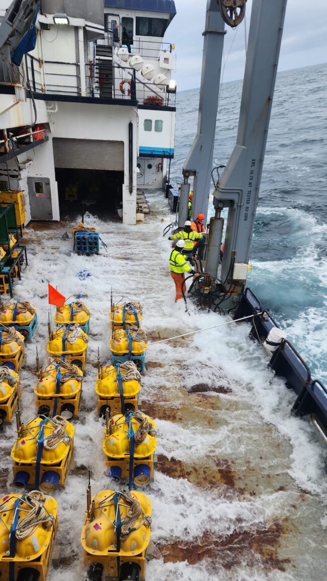 Deployment of seismometer instruments on ship in ocean
