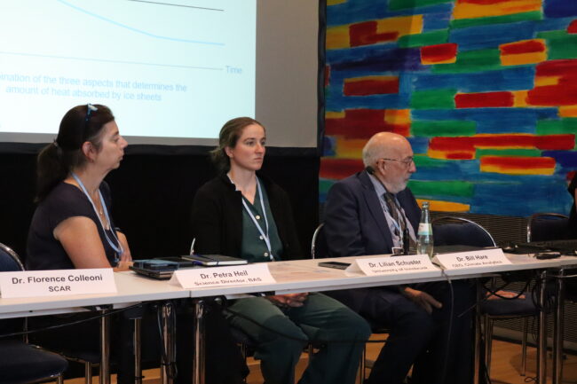 Three speakers on a panel