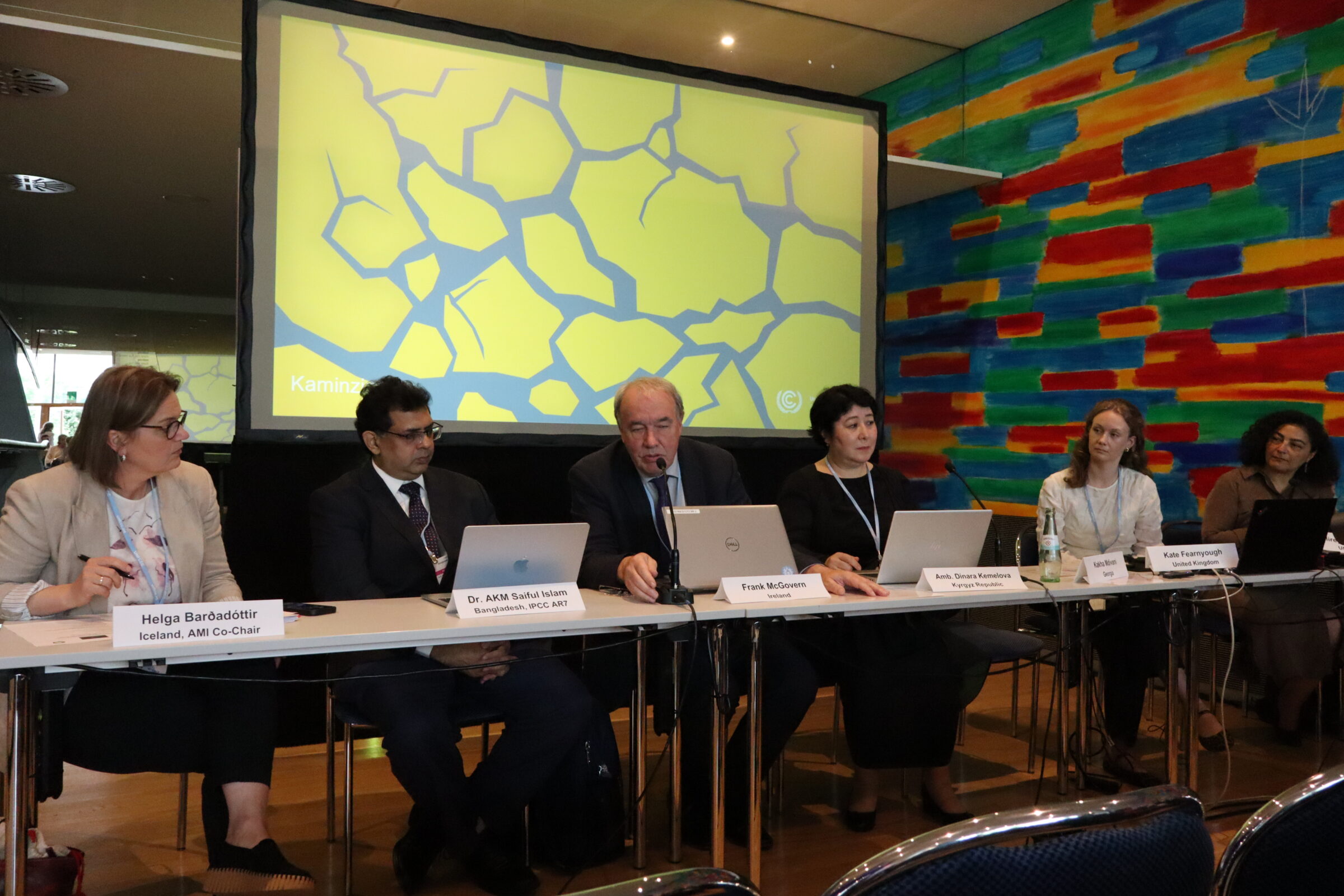Five speakers on a panel
