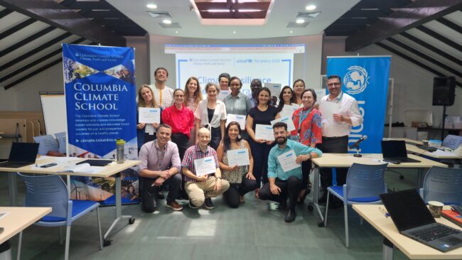 Group of people posing with certificates at a Columbia Climate School and UNICEF event