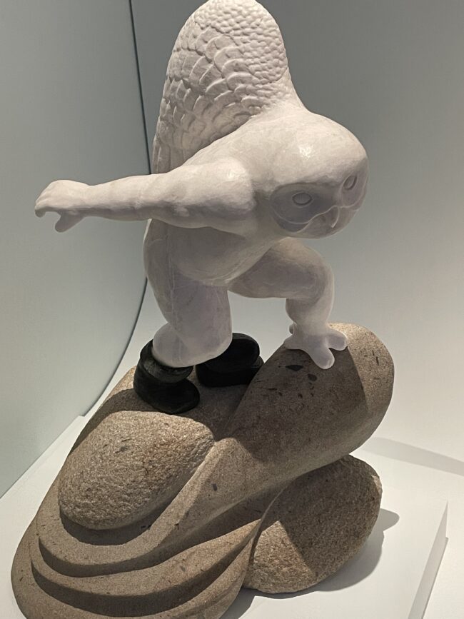 A sculpture showing a a man transforming into a bird