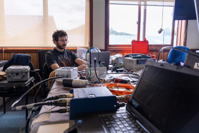 Conor Bacon at the headquarters  of OVDAS, in Temuco. The project team assembled, tuned and tested each instrument in the workshop ahead of deployment on Villarrica. Photo by Francesco Fiondella