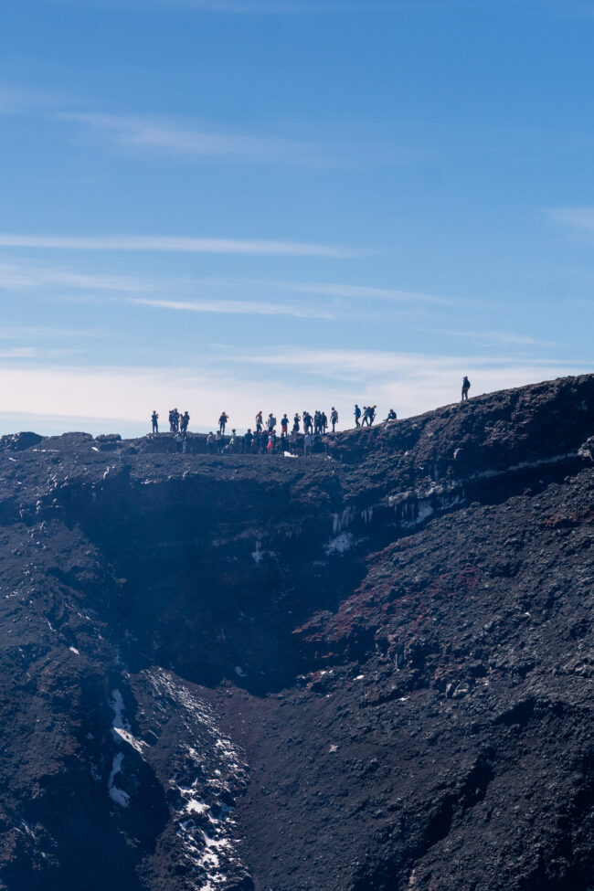 silhouette of hikers on top of villarrica.