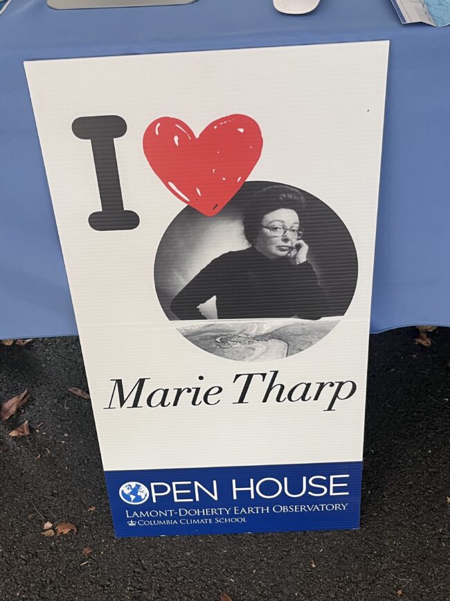 Sign honoring Marie Tharp, featuring “I ♥” above her portrait and identifying the Lamont-Doherty Earth Observatory Open House