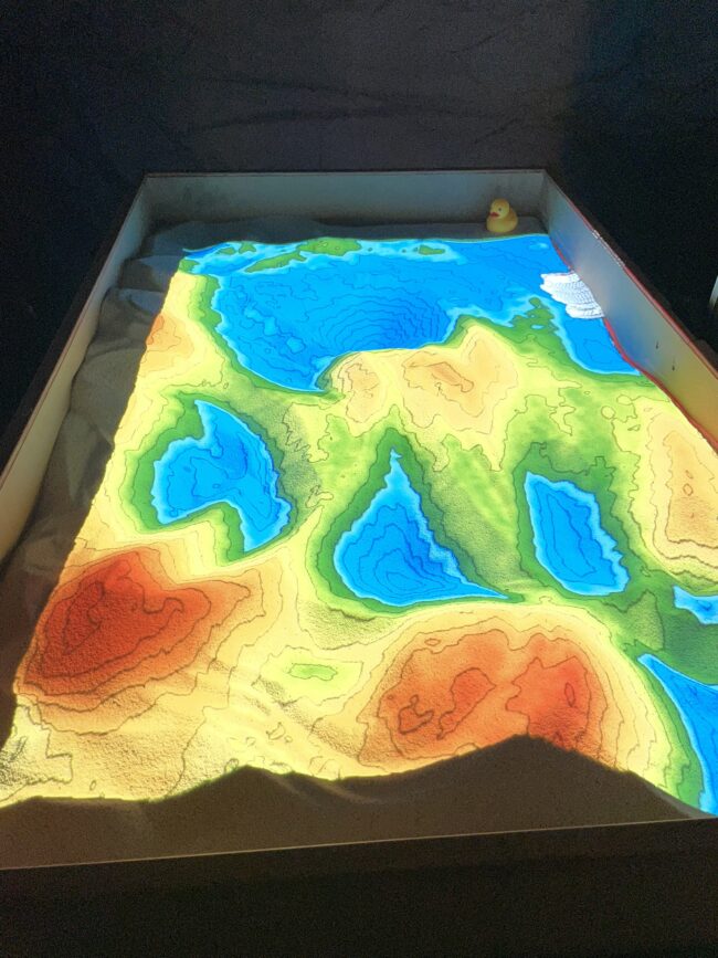 Sandbox where different colors represent different underwater depths